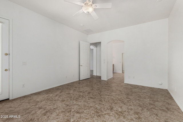 2425 W Red Range Way, Phoenix, AZ 85085 - unfurnished bedroom featuring arched walkways and ceiling fan