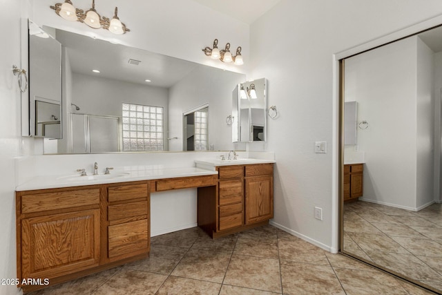 2425 W Red Range Way, Phoenix, AZ 85085 - bathroom with double vanity, an enclosed shower, and tile patterned floors