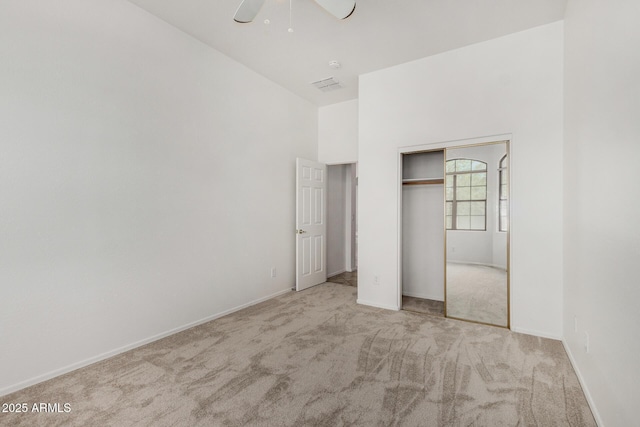 2425 W Red Range Way, Phoenix, AZ 85085 - unfurnished bedroom featuring carpet, a closet, and a high ceiling