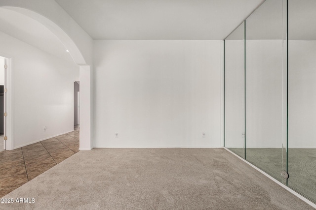 2425 W Red Range Way, Phoenix, AZ 85085 - carpeted empty room with arched walkways