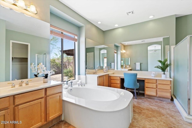 bathroom featuring tile patterned floors, vanity, and plus walk in shower