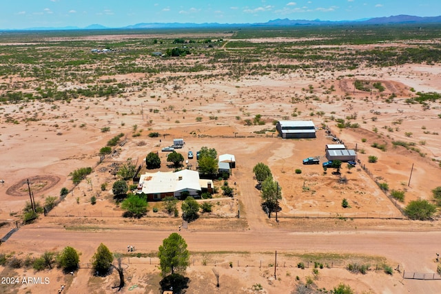 drone / aerial view with a mountain view and a rural view