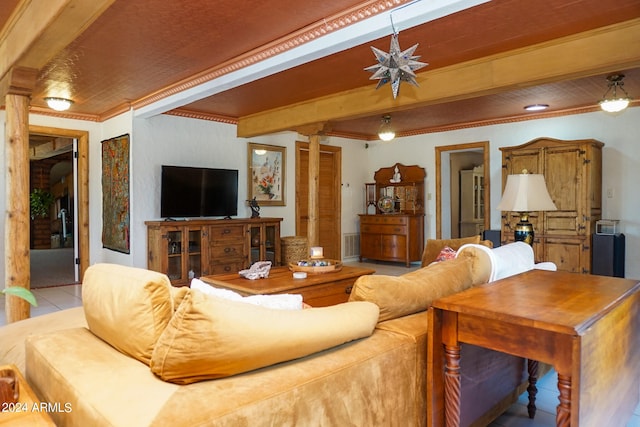 living room with crown molding and light tile patterned floors