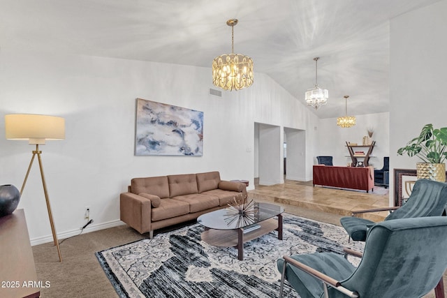 living room with high vaulted ceiling, baseboards, light colored carpet, visible vents, and an inviting chandelier