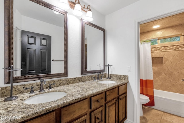 full bathroom featuring toilet, a sink, double vanity, and shower / bathtub combination with curtain