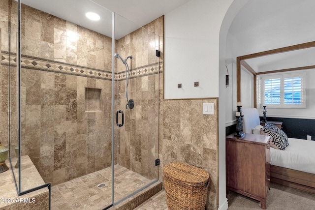 bathroom with a stall shower and ensuite bathroom