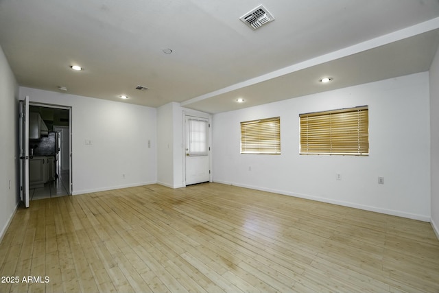 empty room with light wood-type flooring