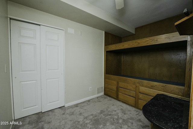 unfurnished room featuring light carpet