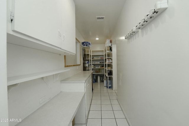 corridor featuring light tile patterned flooring