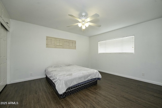 bedroom featuring ceiling fan and dark hardwood / wood-style floors