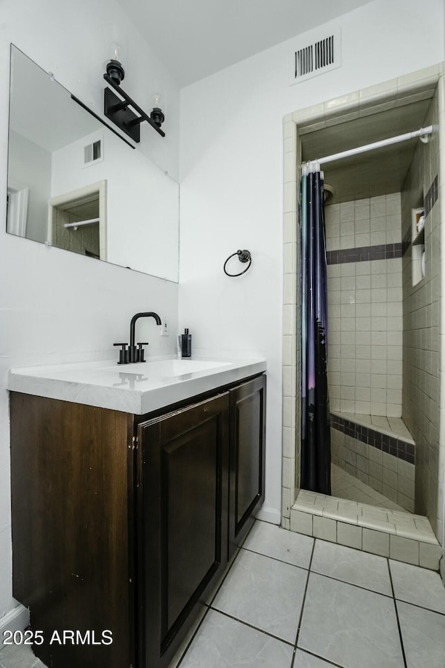 bathroom featuring tile patterned floors, vanity, and a shower with curtain