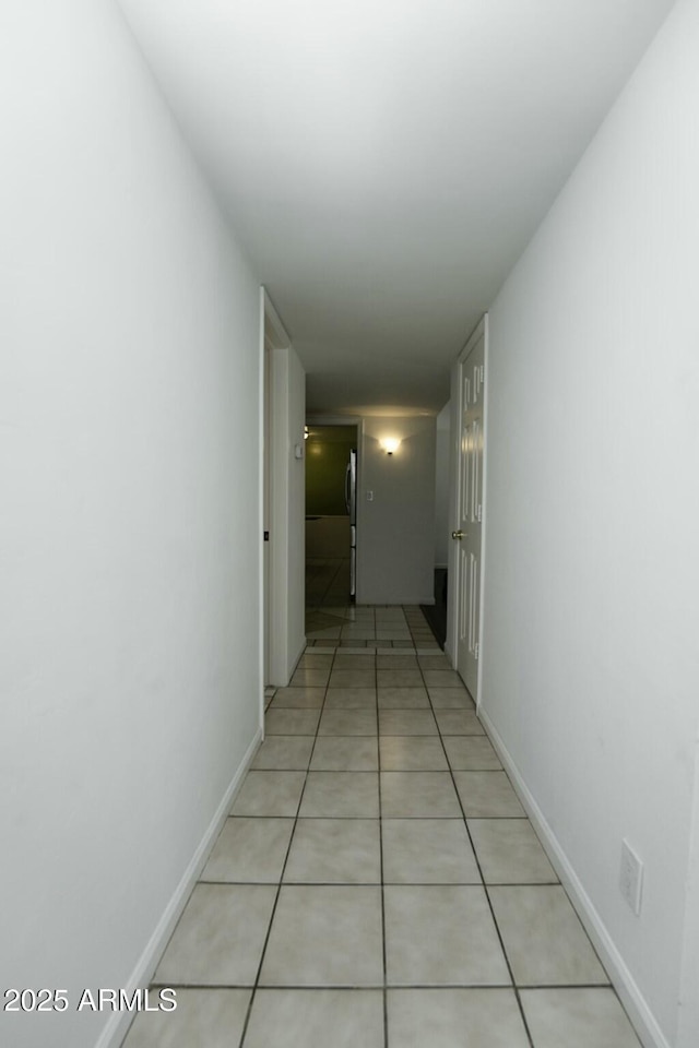 hallway featuring light tile patterned floors