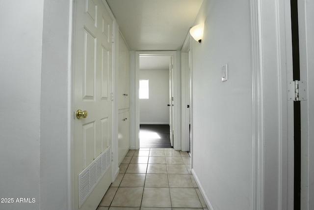 corridor with light tile patterned floors