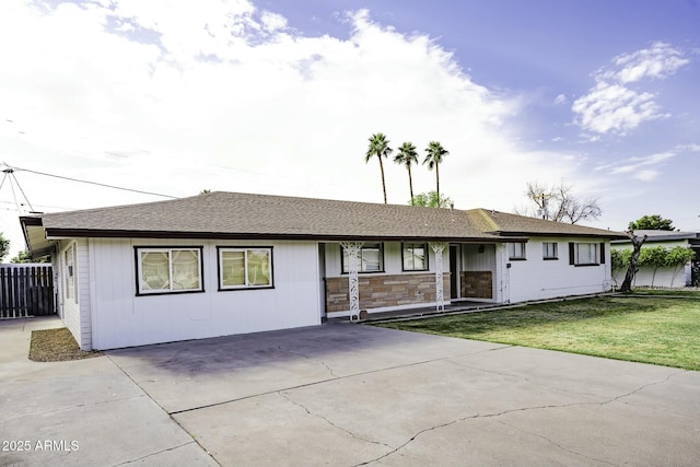 ranch-style home with a front yard