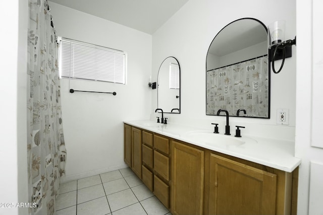 bathroom with tile patterned flooring and vanity