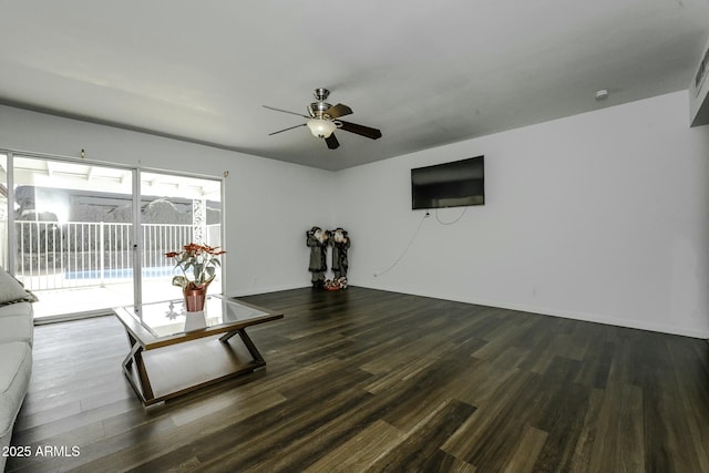 living room featuring ceiling fan and dark hardwood / wood-style flooring