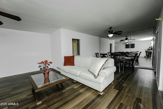 living room featuring dark wood-type flooring