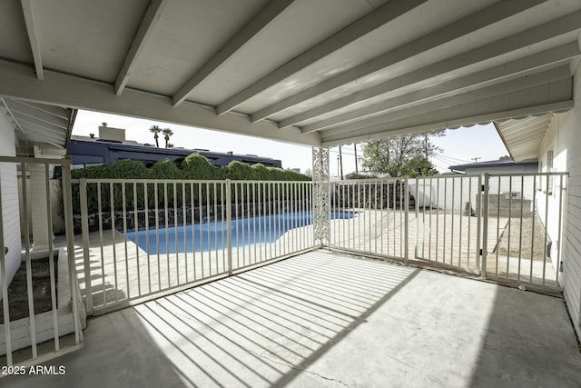 view of patio / terrace with a fenced in pool