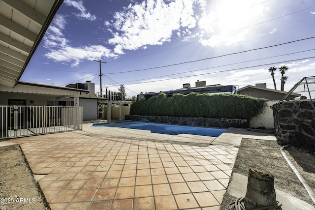 view of patio featuring a covered pool