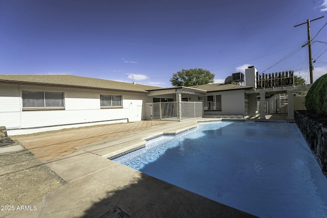 view of swimming pool featuring a patio and central AC unit