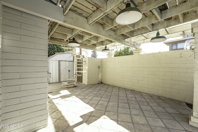 view of patio / terrace with a storage unit