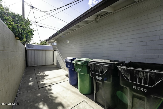 view of patio featuring a storage shed