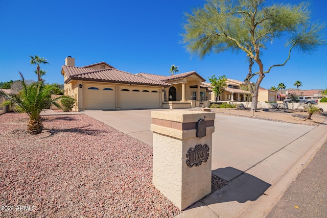 mediterranean / spanish-style house featuring a garage