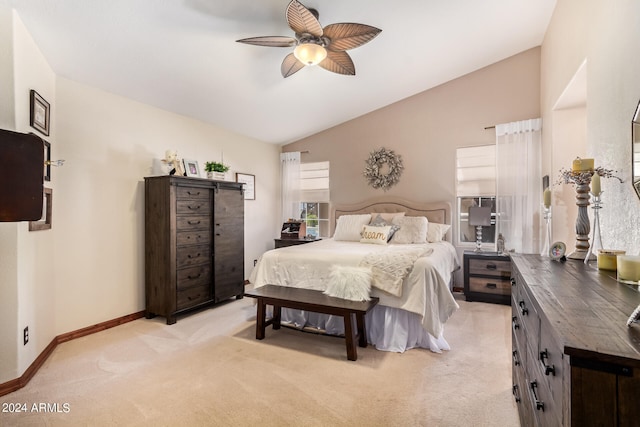 carpeted bedroom with ceiling fan and lofted ceiling