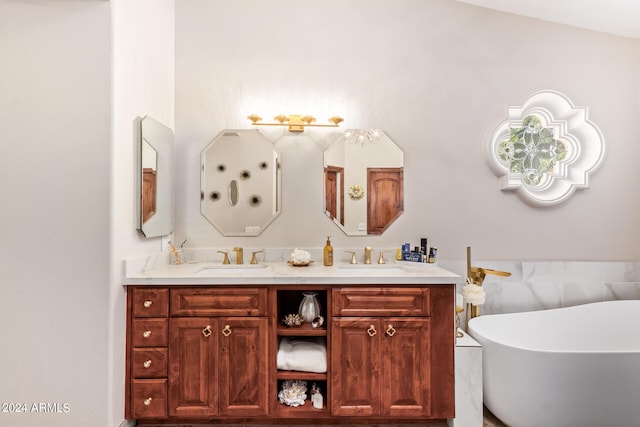 bathroom featuring a bath, vaulted ceiling, and dual bowl vanity