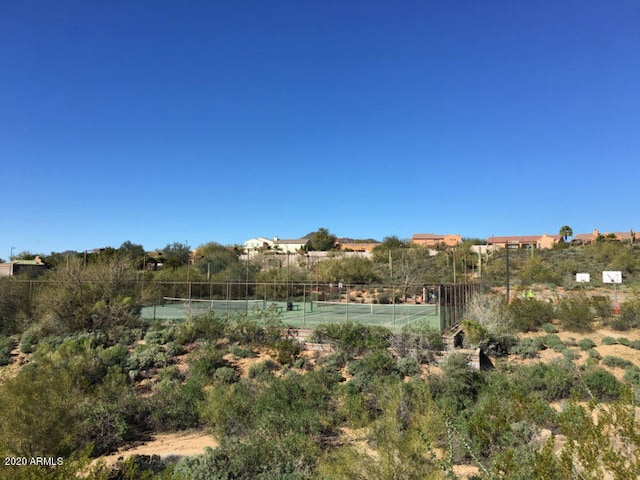 view of yard with tennis court