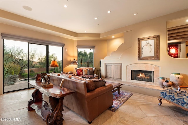 living area featuring recessed lighting and a fireplace