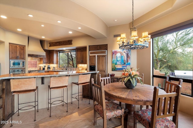 dining space with visible vents, recessed lighting, and an inviting chandelier