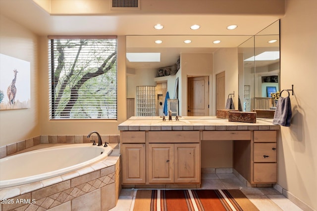 bathroom with visible vents, tile patterned floors, recessed lighting, a bath, and vanity