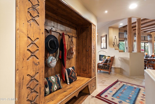 mudroom with recessed lighting and marble finish floor