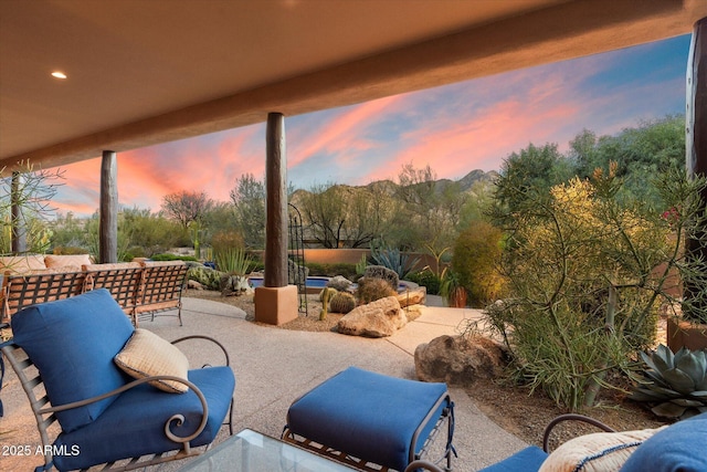 view of patio terrace at dusk