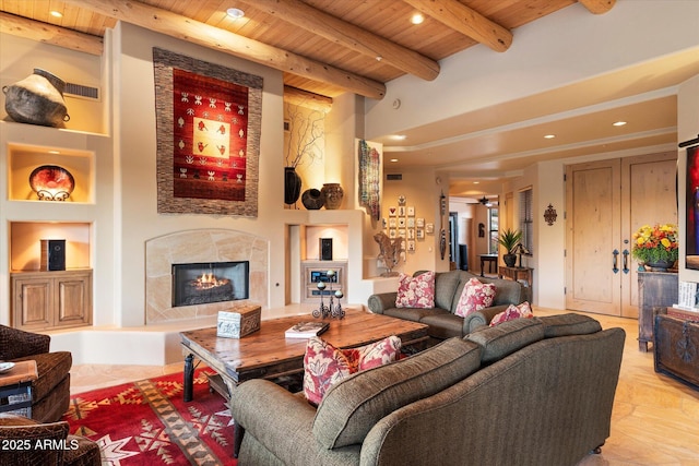 living area featuring built in features, beam ceiling, recessed lighting, a high end fireplace, and wood ceiling