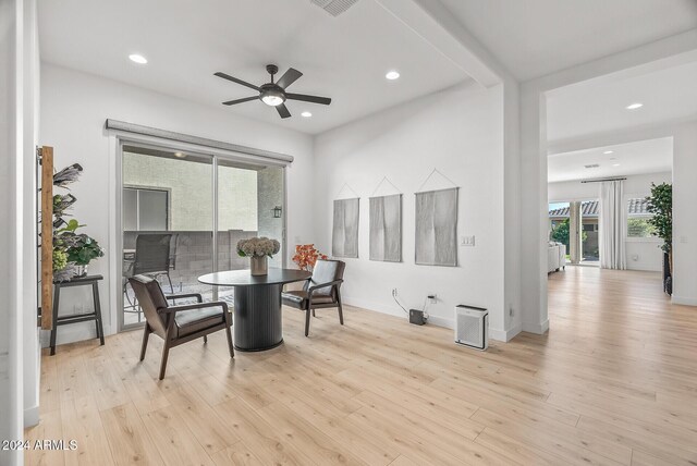 dining room with light wood-type flooring and ceiling fan