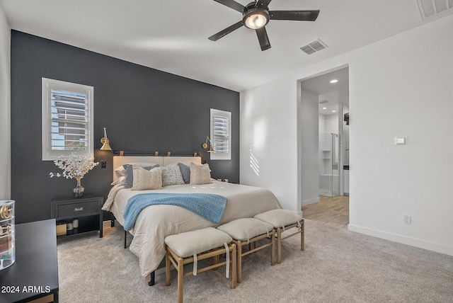 bedroom with ceiling fan and light colored carpet