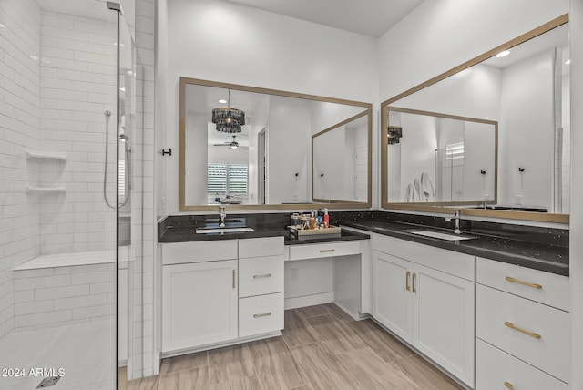 bathroom with vanity, an enclosed shower, and wood-type flooring