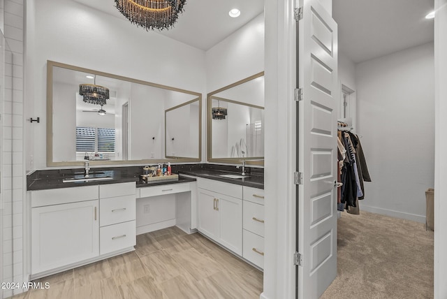 bathroom featuring vanity and ceiling fan