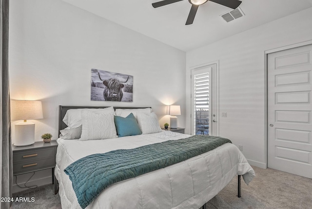 carpeted bedroom featuring ceiling fan and lofted ceiling