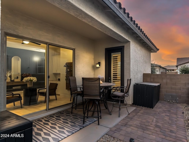 view of patio terrace at dusk