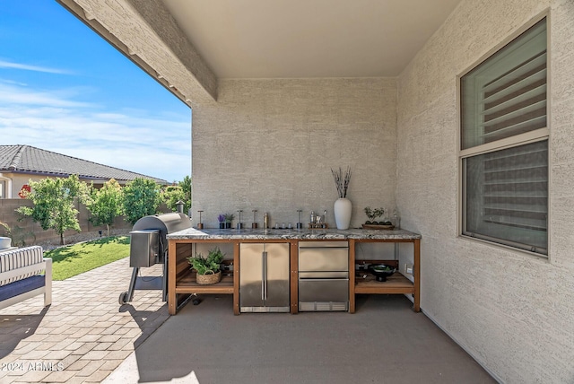 view of patio with exterior kitchen