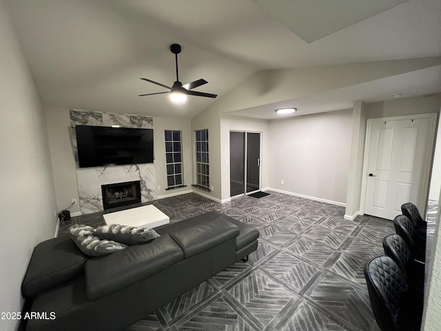 living room with lofted ceiling, a fireplace, ceiling fan, and carpet flooring