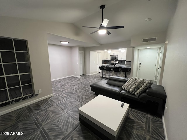 living room featuring lofted ceiling and ceiling fan