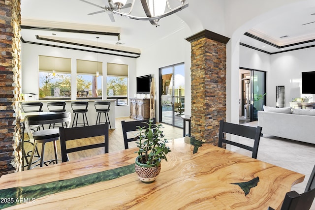 dining room with ceiling fan, light wood-type flooring, and ornamental molding