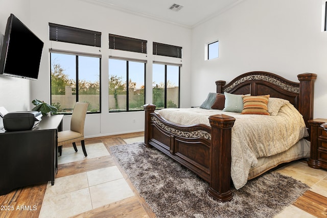 bedroom with crown molding