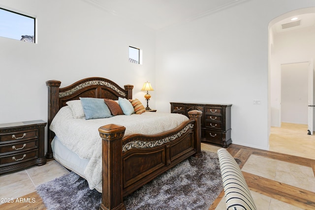 bedroom with ornamental molding