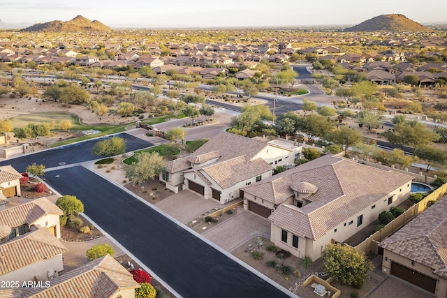 birds eye view of property with a mountain view