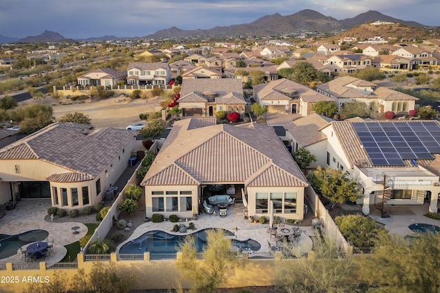 birds eye view of property featuring a mountain view